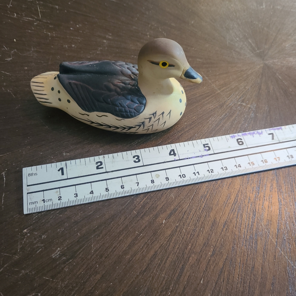 Sigma Beauty Cream and Black Decorative Duck Figurine